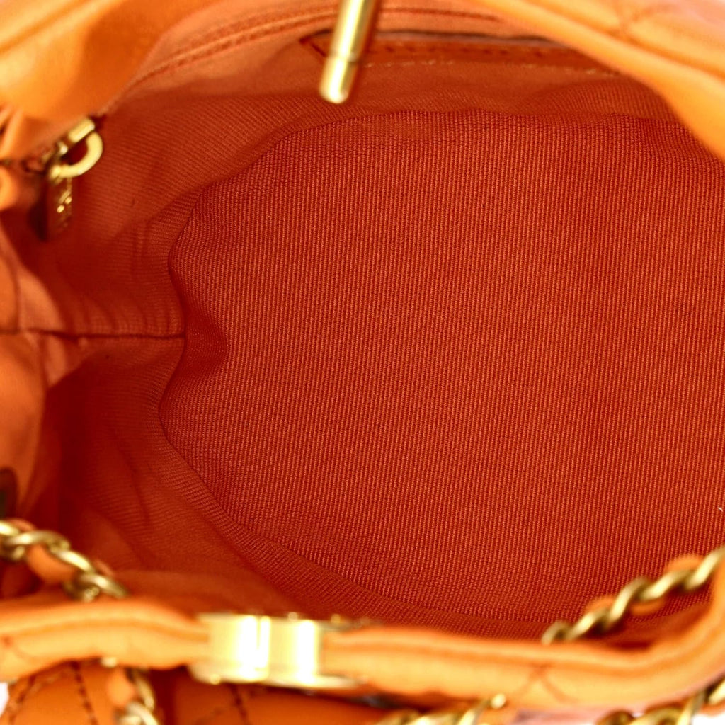 Chanel, CC Pocket Chain Bucket Backpack Quilted Lambskin Small, Orange